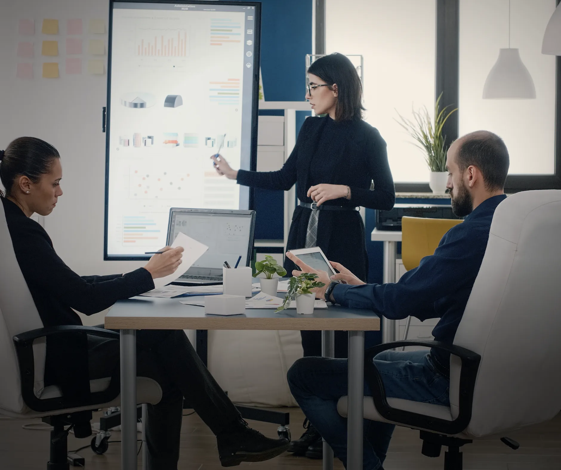 Marketing team reviewing campaign performance charts in a strategy meeting